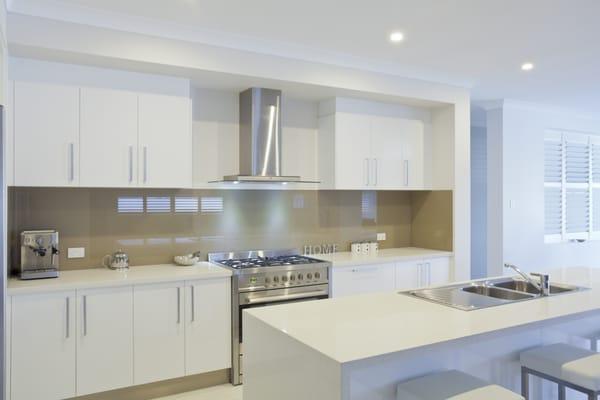 White Acrylic Cabinets and Beige Acrylic Back Splash Panel