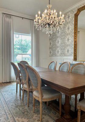 Designer roller shades paired with custom drapes makes a statement and provides double the lighting and privacy options.