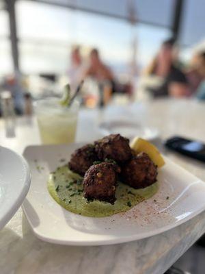 Crab and Corn Fritter on jalapeño avocado aioli