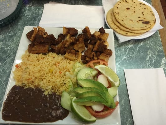 Chicharrone plate with rice, beans, tortillas & salad