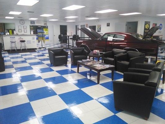 Well lit and large showroom with a comfortable lounge