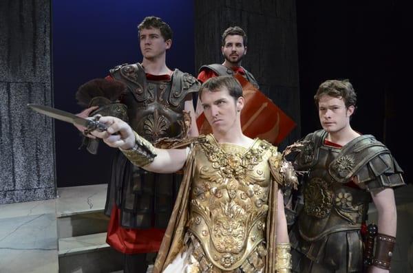 JULIUS CAESAR (Aaron Blanco) with sword & his men, (l to r) Brutus (James Conway), Cassius (Joe Hubbard) & Marc Antony (R.D. Mower).