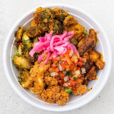 All-In Bowl with avocado, citrus rice, crispy fried chicken, citrus chipotle chicken, brussels,
 Buffalo avo broccoli & pickled onions