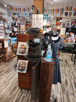 Entrance of Outsider Comics including masks provided for customers.