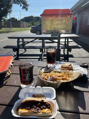 Chili cheese dog, root beer in a frosted mug, shoe string fries, pizza burger