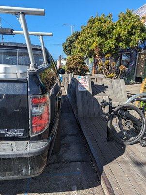 Please, folks, stop double parking in front of bike racks/store entrance in order to shop.