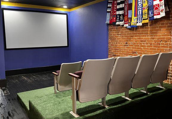 Inside - stadium seating and big screen/projector