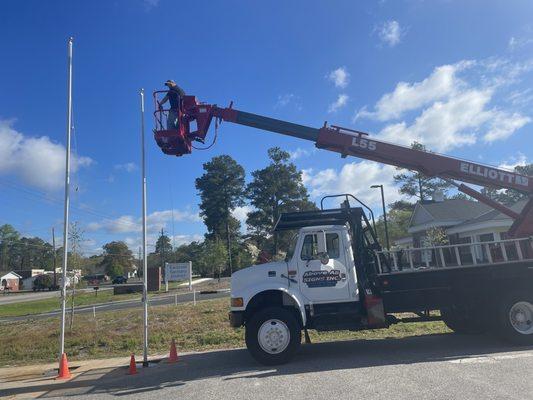 Installing new flag poles.