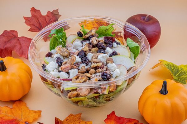 Fall Harvest Salad. Mixed greens, apples, pears, dried cranberries, smoky bacon, feta cheese and candied walnuts.