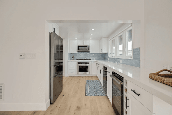 Custom cabinets with beverage cooler built in & wine rack