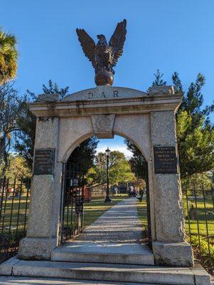 Colonial Park Cemetery on Black Friday, November 24, 2023. Storefront. Entrance at corner of E Oglethorpe Ave and Abercorn St. Portrait.