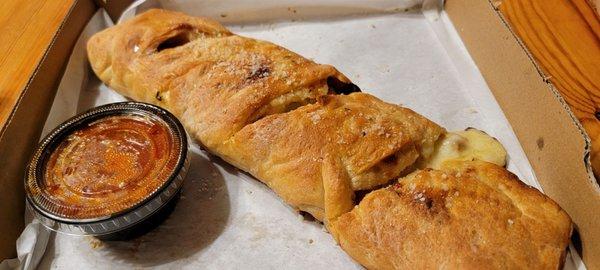 All meat stromboli with ham, salami, pepperoni and sausage. We got a good stretch of cheese on the first bite. Very tasty!