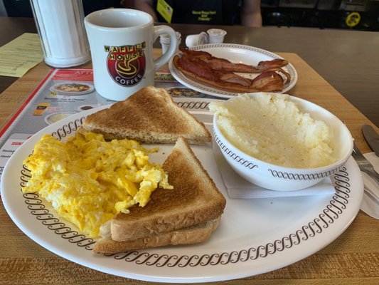 Two egg breakfast with bacon and grits