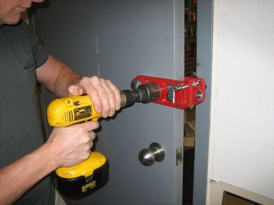 Installing a deadbolt.