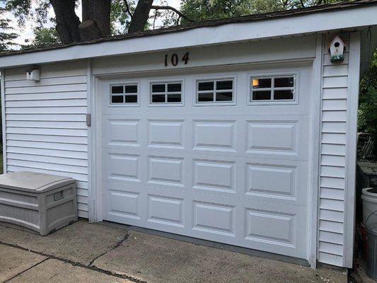 New garage door in white with glass top section