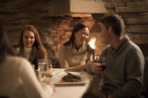 Cozy dinners by our enormous fireplace in the Wigwam dining room located in our Frank Lloyd Wright clubhouse.