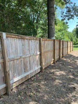 Showing the difference from dry unstained wood and to the right is stained and protected in a natural color.