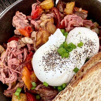 6 Hour Hash - Pulled corned beef, potato, onion, pepper, two poached eggs, and toast.