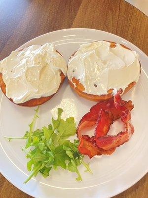 Toasted bagel with cream cheese and bacon