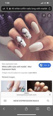 Example of all white coffin nails with marble accent nail from online