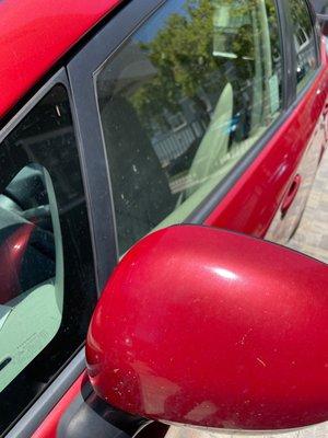 Visible water drops and dirt on mirror