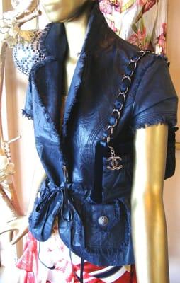 Cavalli leather jacket, silk print skirt, with navy Chanel quilted bag.