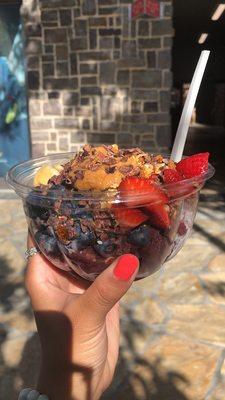 Açaí bowl with peanut butter and cacao nibs