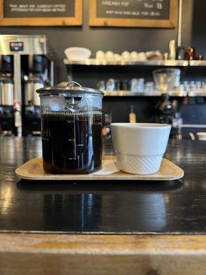 Drip coffee served in a French press.