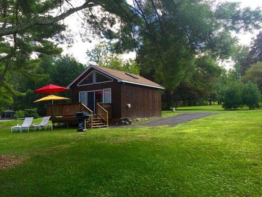 Back view of cottage: deck & BBQ with outdoor furniture for your enjoyment.