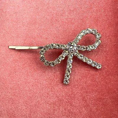 Silver (Rhodium) Plated Bow Bobby Pin by Dauphines of New York Luxury Hair Accessories. Visit our NYC Boutique Showroom for Hair Accessories