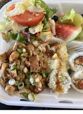 Teriyaki chicken, rice, sushi rolls, salad and fresh fruit