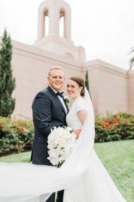 dangling white orchid bridal bouquet for wedding at Newport Beach, California Temple