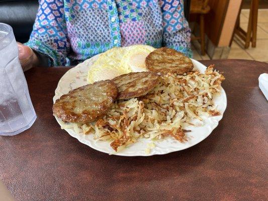 Easy over eggs, sausage patties and hash browns