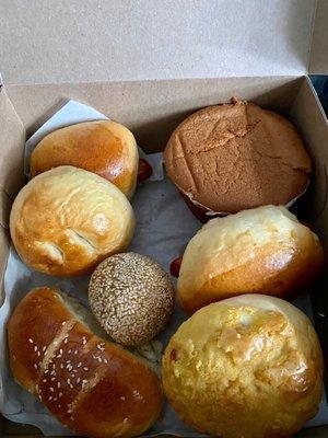 Assorted buns, mochi sesame ball, and paper cake