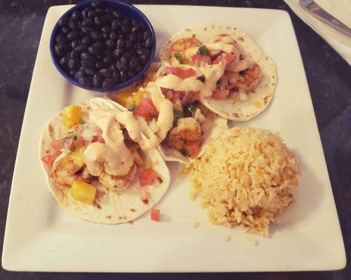 Shrimp tacos-inclides black beans and rice.