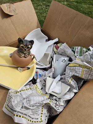 Broken dishes, cups, plates.