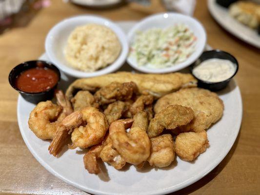 Fried seafood platter with fried fish, fried oysters, fried scallops, fried shrimp, and a crabcake that was spoiled.