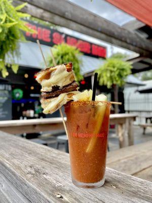 The Melty Mary: Tito's Handmade Vodka, signature Bloody Mary mix, Certified Angus Beef patty, 2 American grilled cheese buns, garnishes