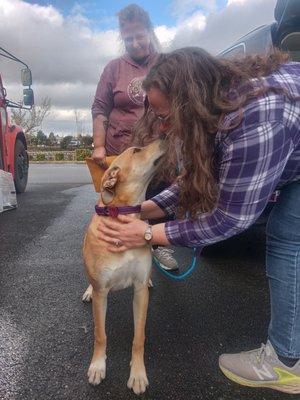 Adopter meeting their new furbaby for the first time.