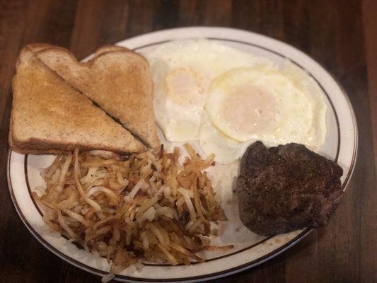 Steak, eggs, has brown and toast