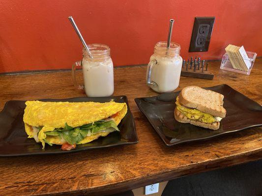 Custom omelet with Swiss, spinach and tomato and egg sandwich on gluten free bread.