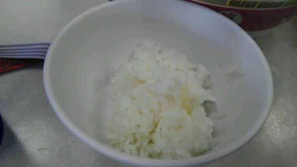 Meals come with small bowls of rice.