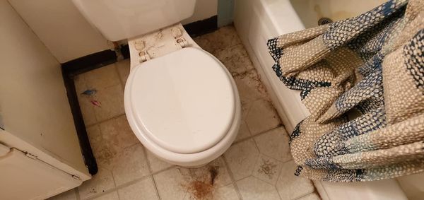 Dirty toilet and floor