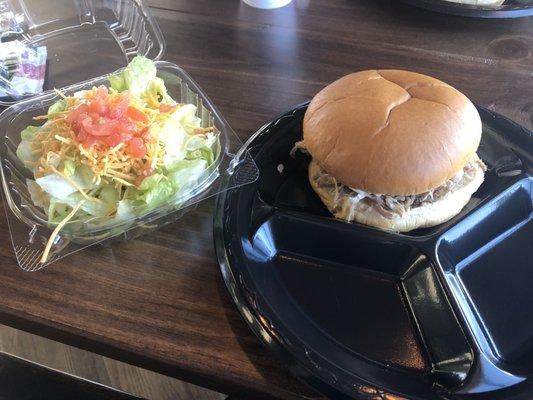 Pork sandwich and side salad