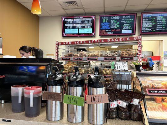 Coffee choices, bagel stand, and menu.