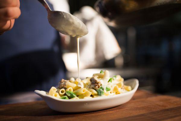 Baked Rigatoni Carbonara - parmesan cream, fennel sausage, snap pea, runny egg