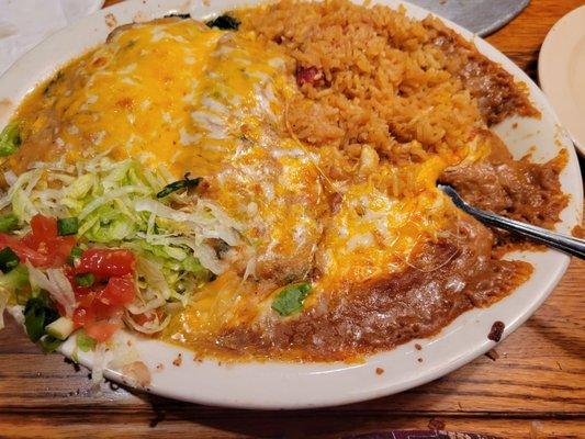 Spinach enchilada plate with refried beans and Spanish rice