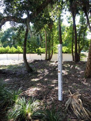 A post with words of peace in various languages graces the small nature walk out back.