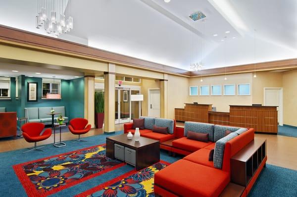 The hotel lobby provides comfortable furniture and modern decor.