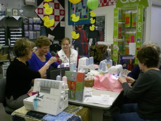 Having fun at one of our sewing parties